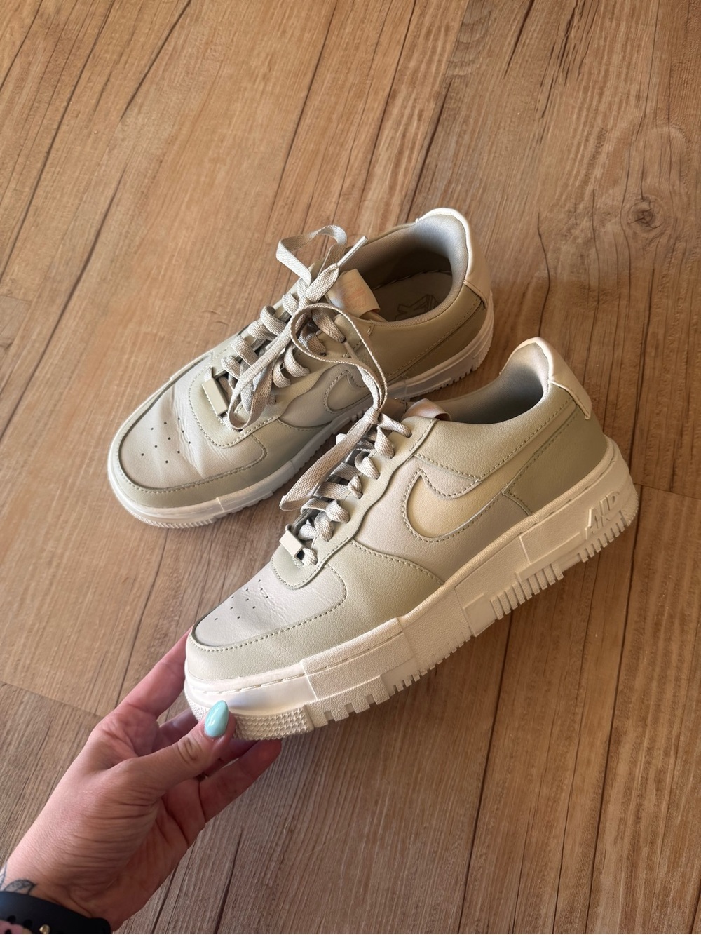 Nike Air Force 1’s Cream Low-Top Sneakers